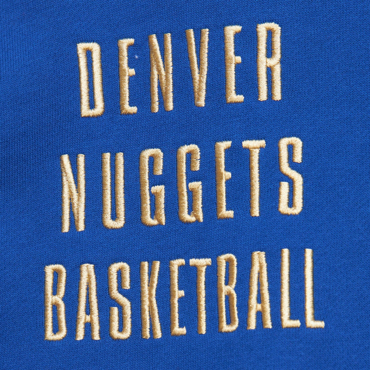 "Denver Nuggets Basketball" written in gold letters on the right chest.
