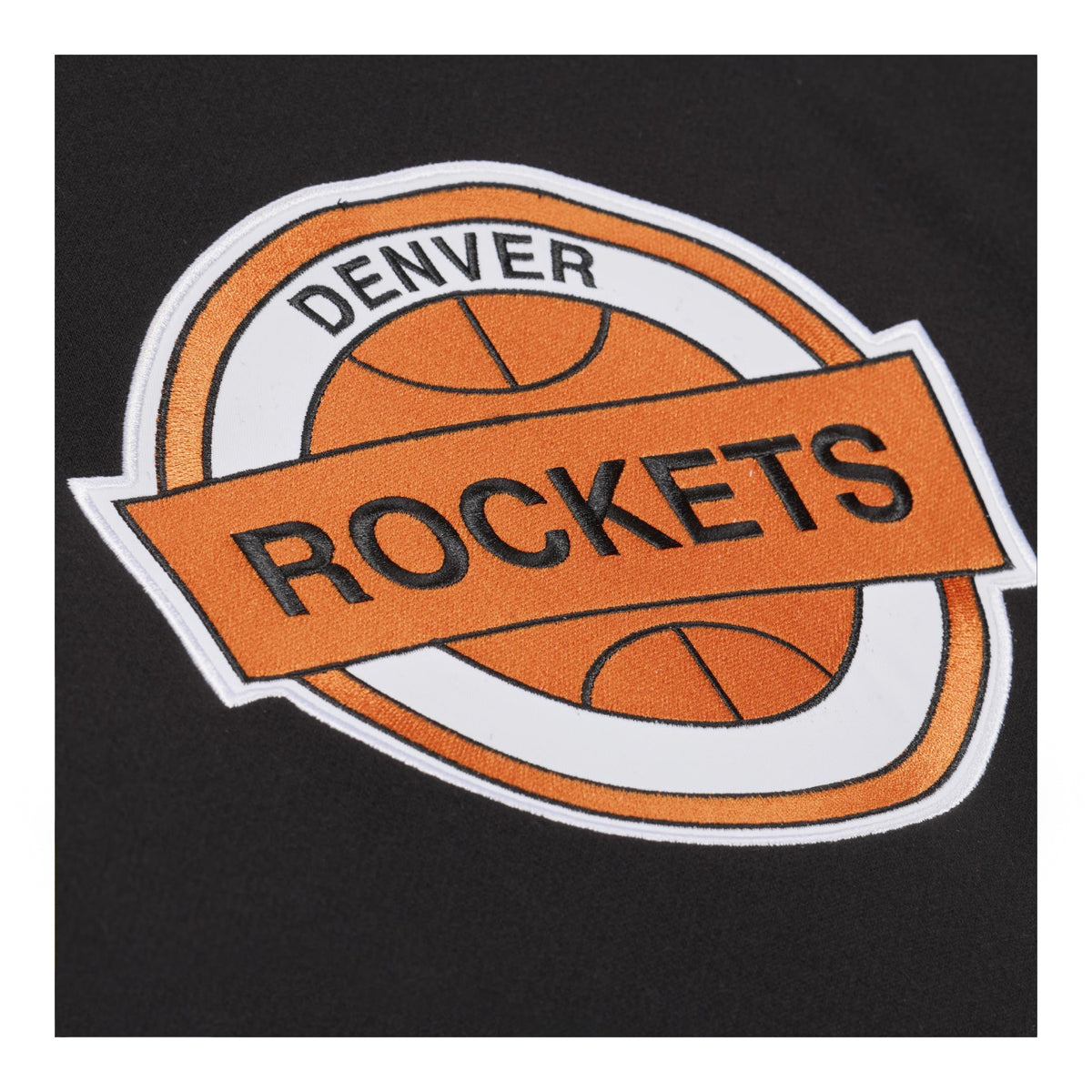A close-up of a black garment featuring a large embroidered Denver Rockets logo patch in orange, white, and black.