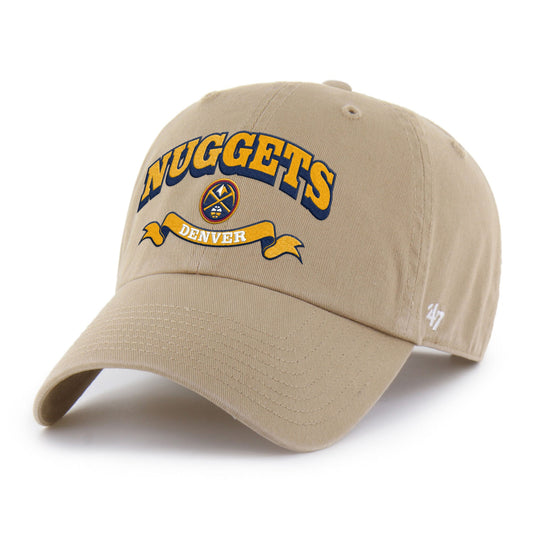 Beige cap with text in Gold with navy drop shadow of Nuggets.  Nuggets Primary logo below text and gold ribbon with white text Denver on a white background, left facing view