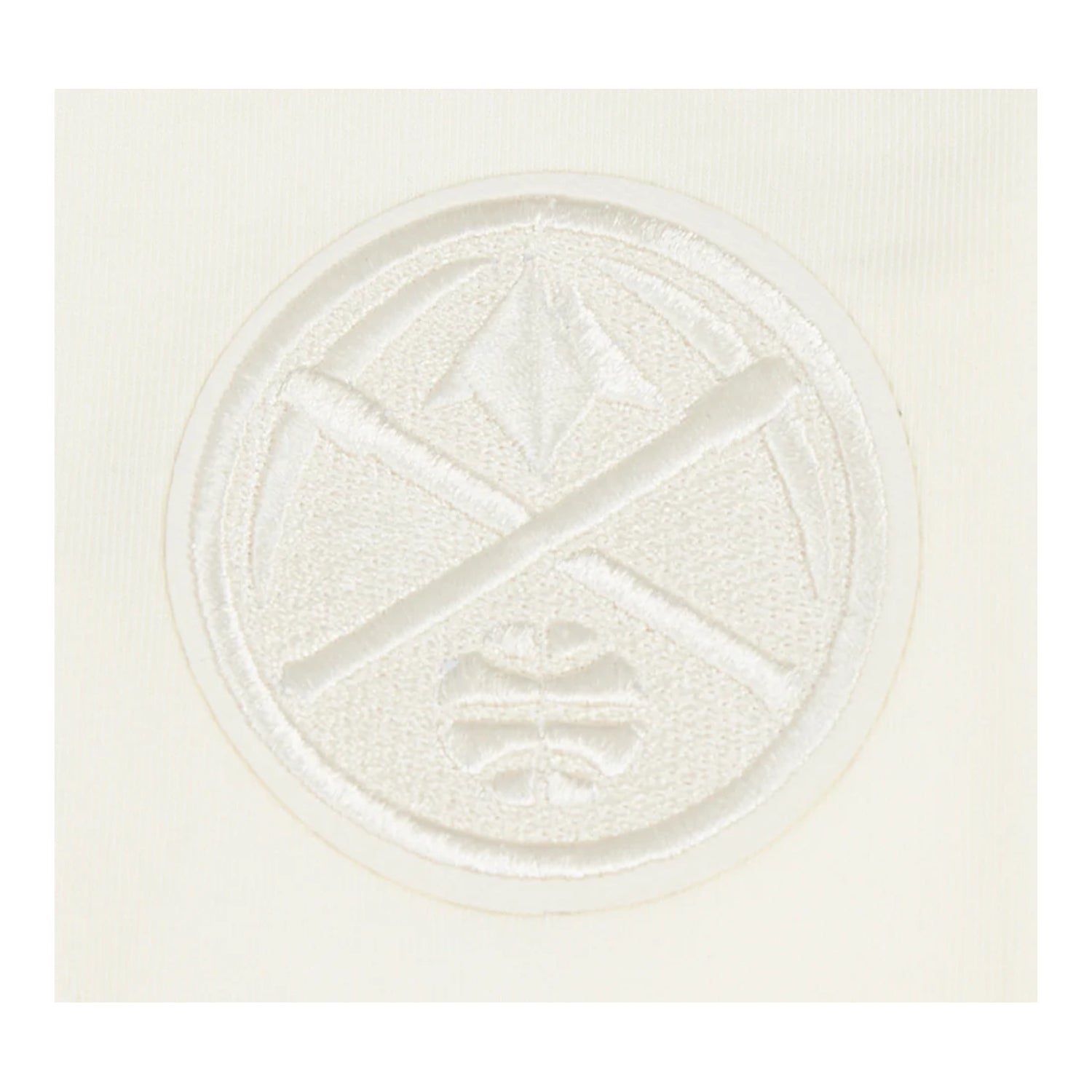 Up close view of a small Denver Nuggets logo emblem on the upper left hip.