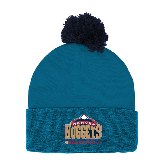 Blue beanie with pom-pom and Old Denver Nuggets Mountain logo on a white background