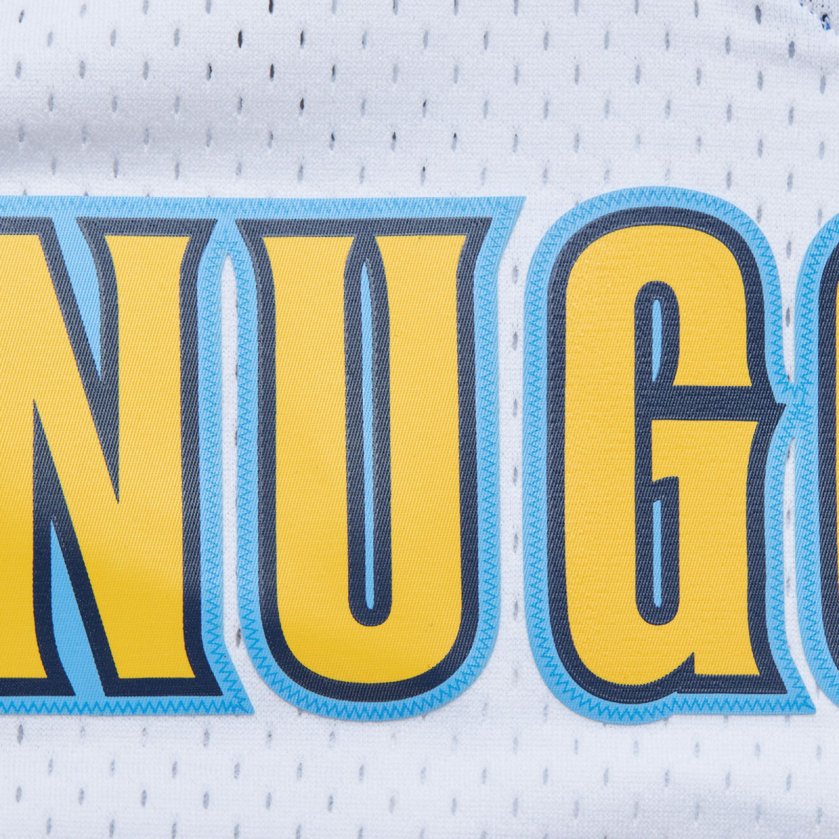 Up close view of front White basketball jersey with Nuggets in yellow, with navy trim, trimmed in light blue 