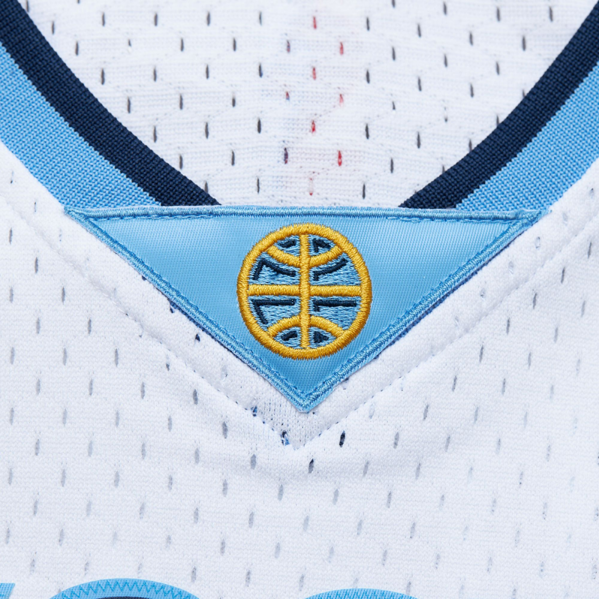 Up close view of front White basketball jersey neckline with light blue triangle with Yellow basketball logo